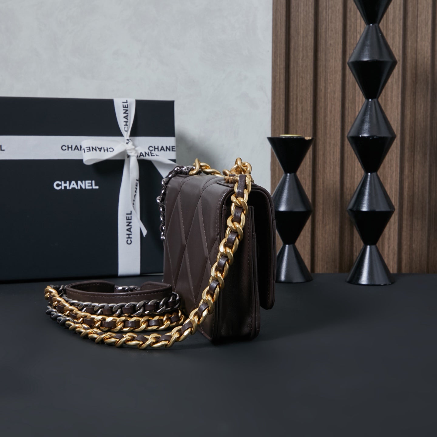 Chanel quilted shoulder bag with gold chain strap, side profile view