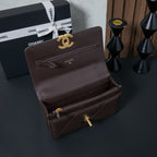 Chanel flap bag with gold CC logo front and interior compartment open