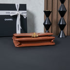 Chanel bag in tan-brown with structured flap and gold clasp hardware