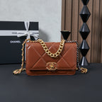 Chanel bag in tan-brown with quilted chevron front and gold chain shoulder strap