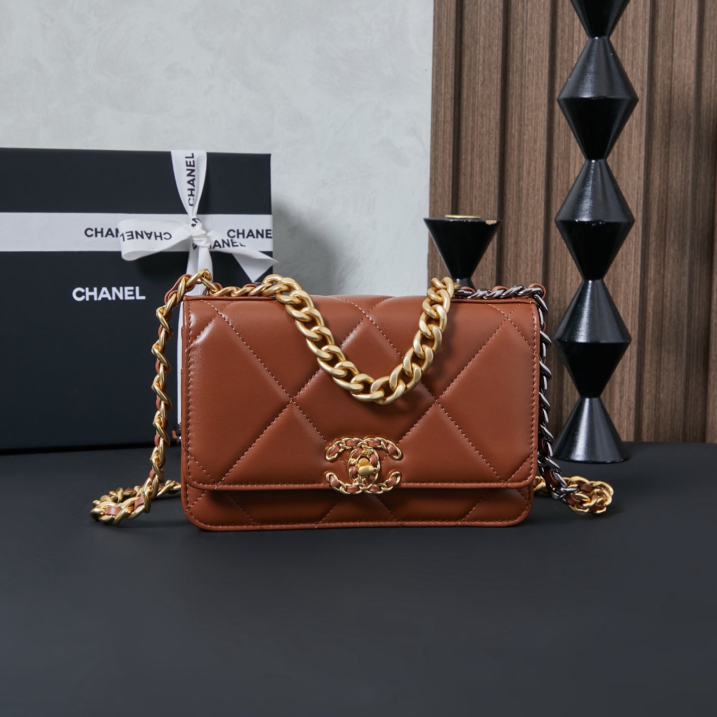 Chanel bag in tan-brown with quilted chevron front and gold chain shoulder strap