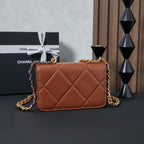 Chanel bag with tan-brown quilted diamond pattern and gold chain shoulder strap