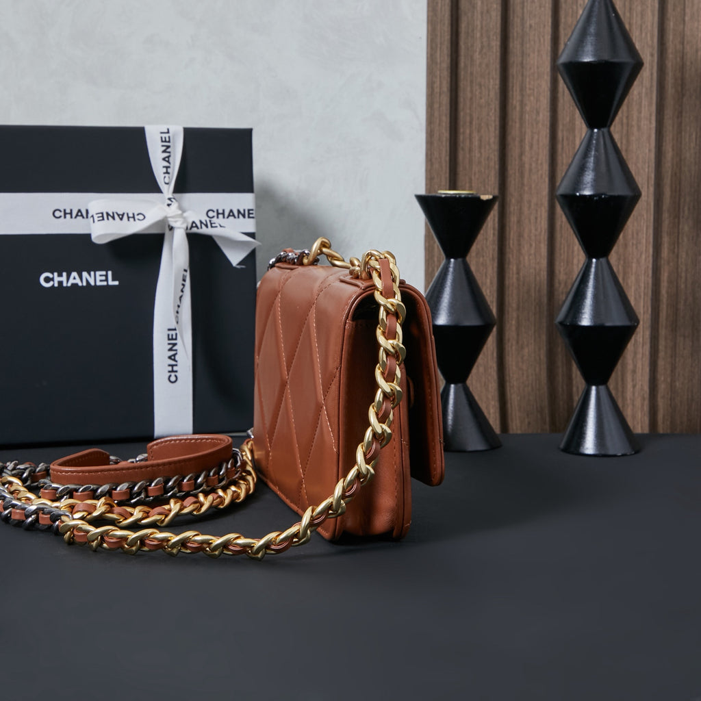 Chanel bag in tan-brown with quilted sides and long gold chain strap