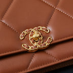 Chanel bag close-up of tan-brown quilted panel with gold chain detail