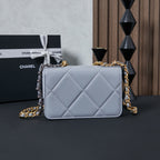 Light blue quilted flap shoulder bag with mixed gold and silver chain straps