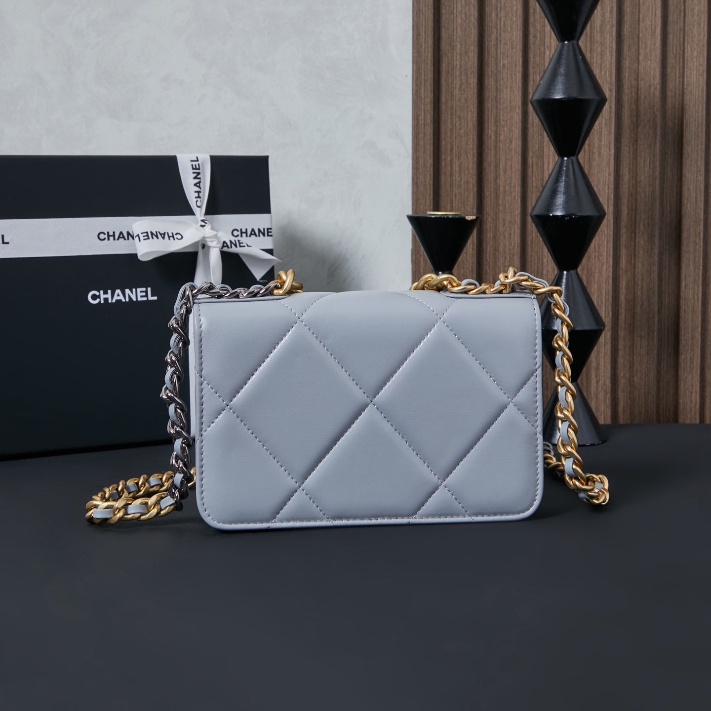 Light blue quilted flap shoulder bag with mixed gold and silver chain straps
