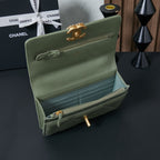 Olive green Chanel flap bag open interior with zipper pocket and gold-tone hardware
