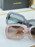 Balenciaga glasses, close-up of blue and pink square-frame lenses