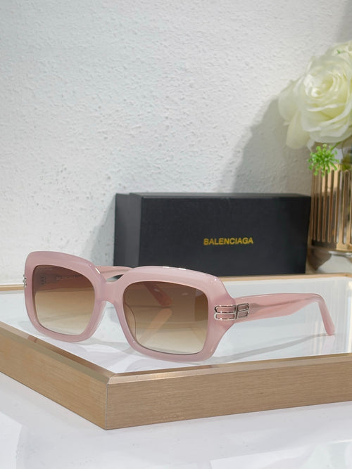 Balenciaga glasses, pale pink frame with oversized square lenses and gold logo