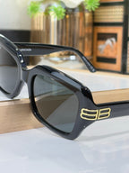Balenciaga glasses, black frame with large square lenses and gold double-B temple logo