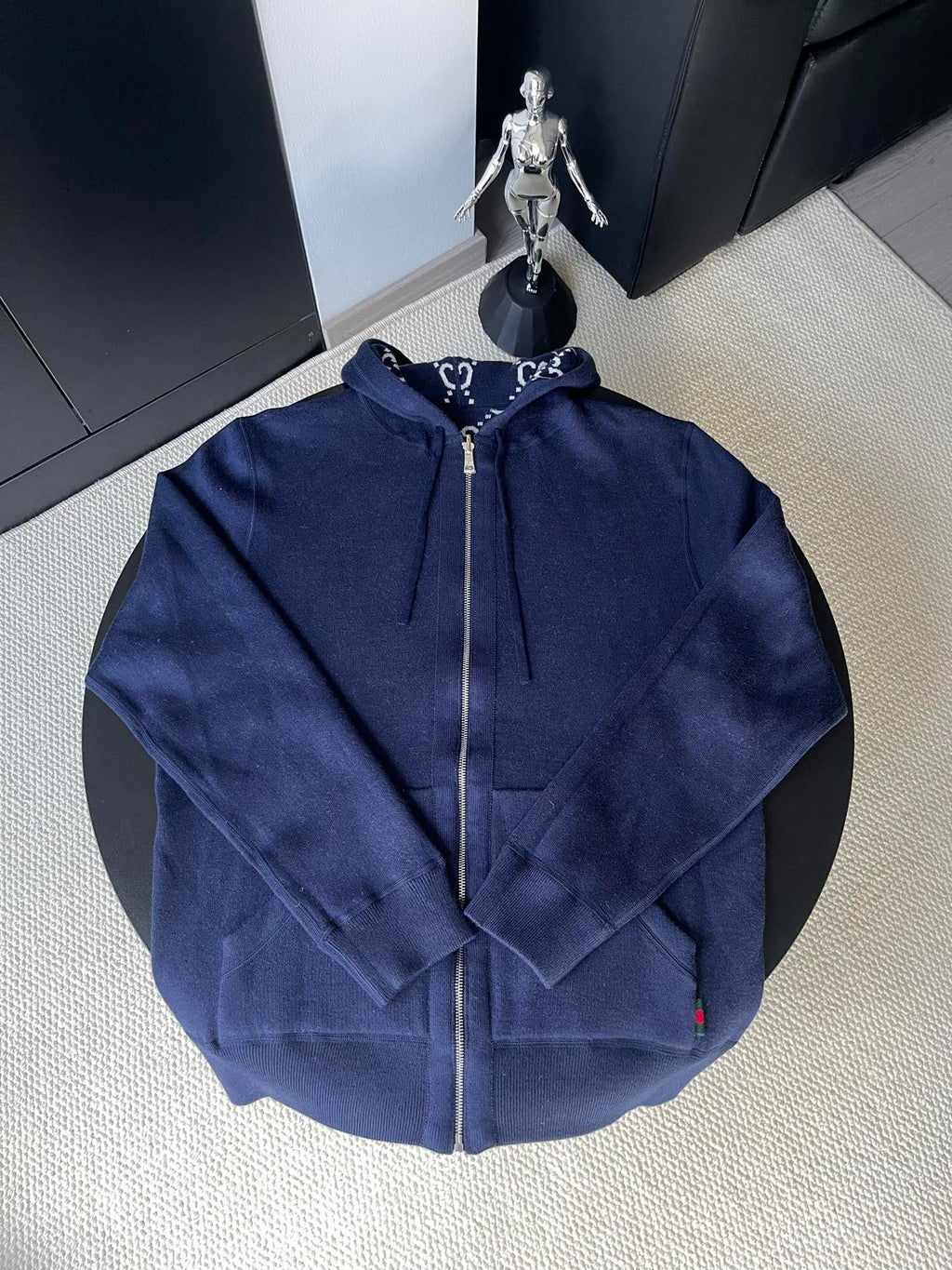 Navy long-sleeve zip hoodie with drawstring hood, back view