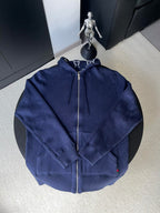 Navy long-sleeve zip hoodie with drawstring hood, back view