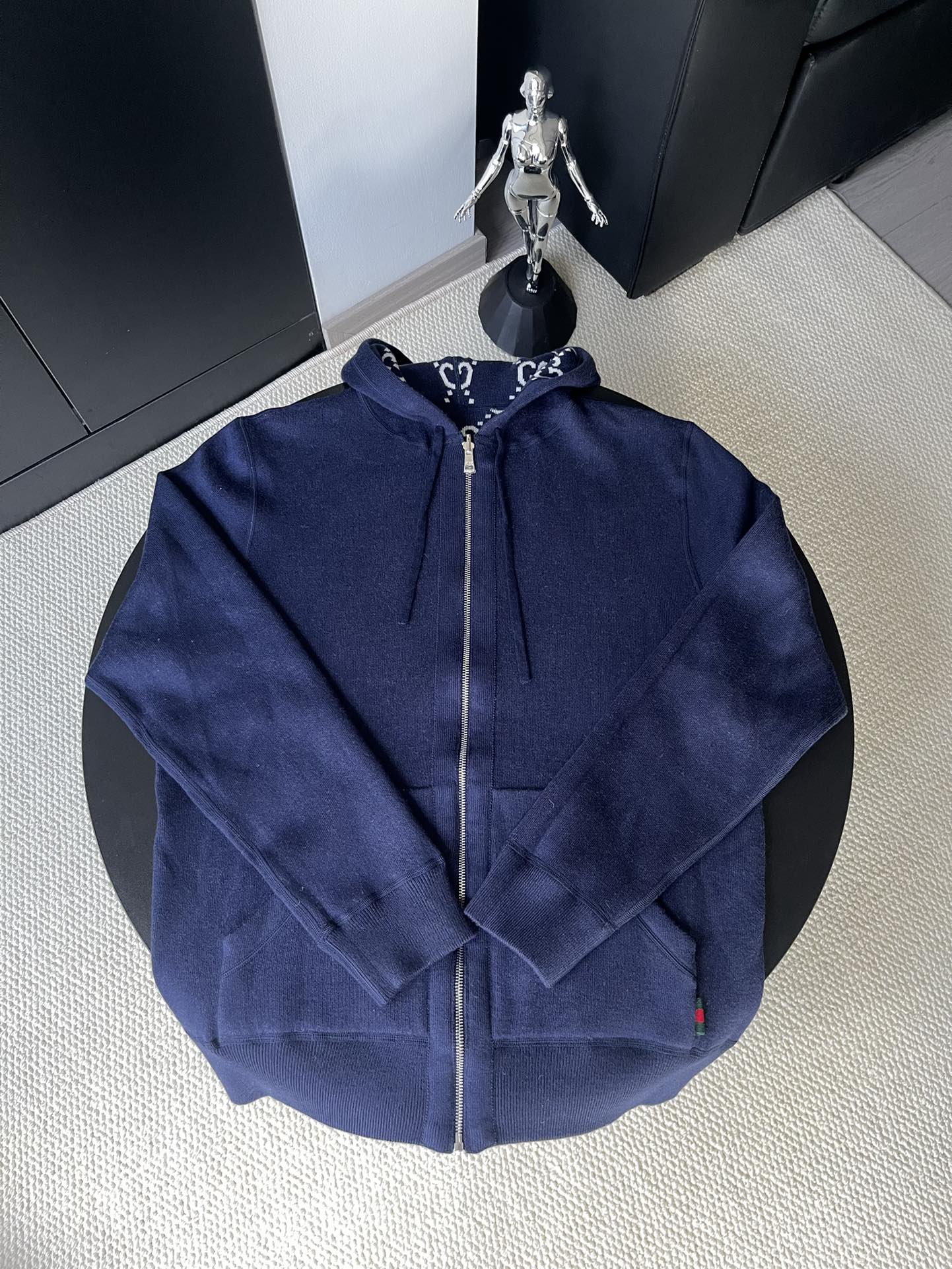 Navy long-sleeve zip hoodie with drawstring hood, back view