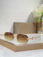 Bvlgari sunglasses with amber gradient lenses and gold-tone metal frames