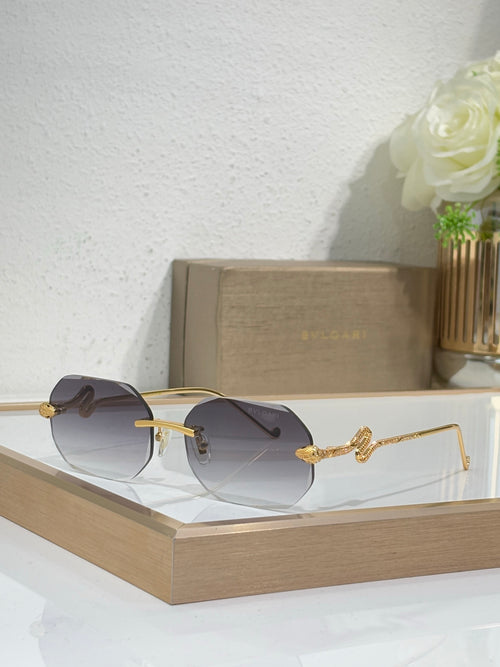 Bvlgari sunglasses with dark gray gradient lenses and gold-tone metal frames
