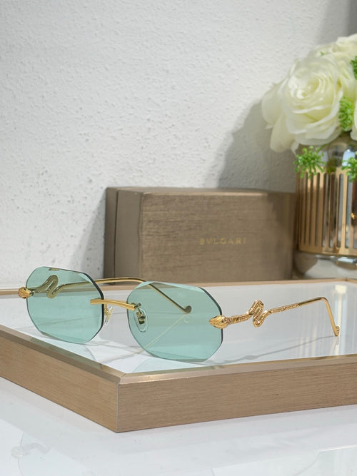 Bvlgari sunglasses with teal gradient lenses and gold-tone metal frames