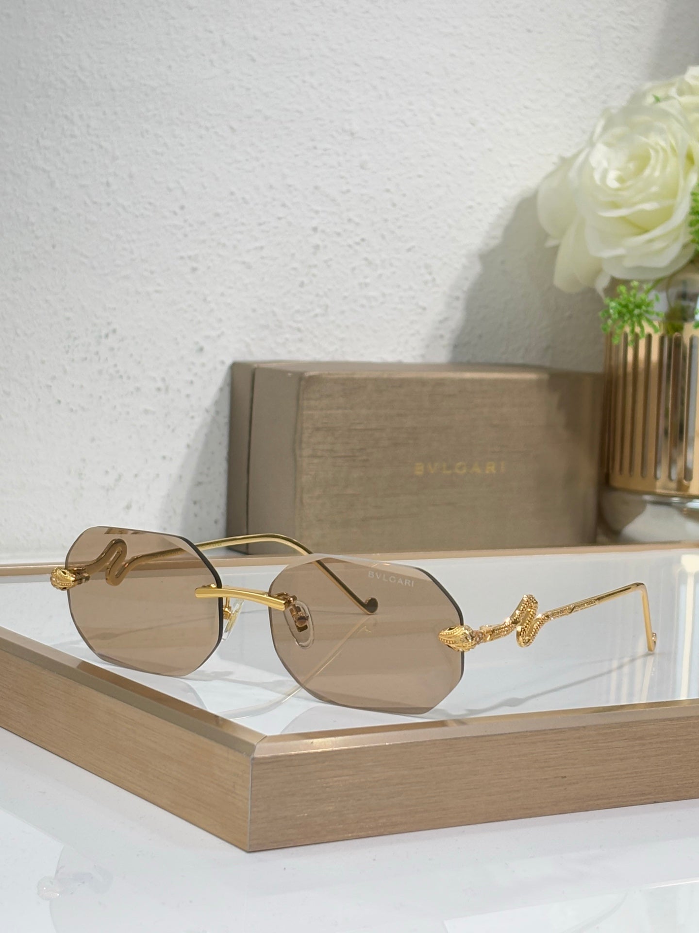 Bvlgari sunglasses with tan gradient lenses and gold-tone metal frames