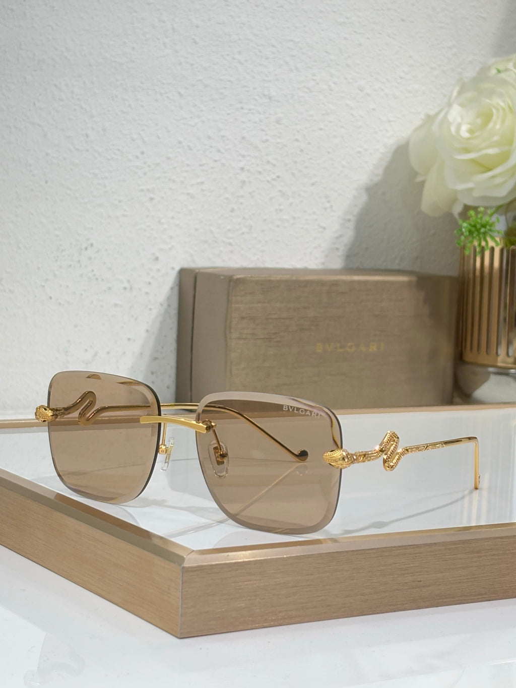 Bvlgari round sunglasses with gold frame and brown tint gradient lenses