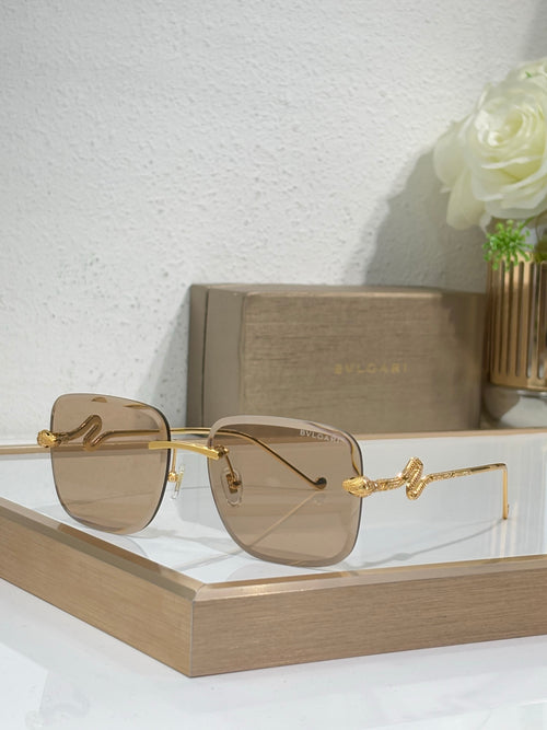 Bvlgari round sunglasses with gold frame and brown tint gradient lenses
