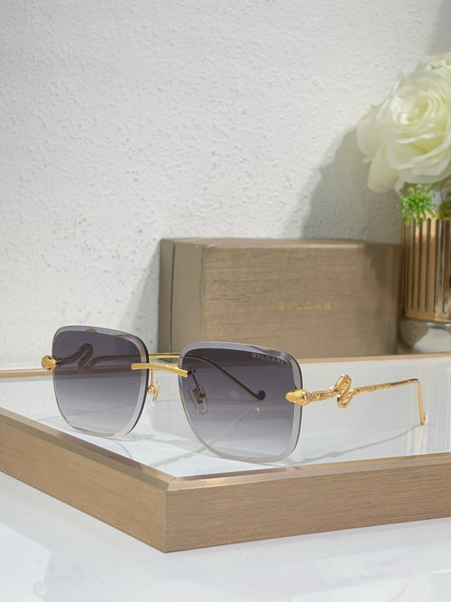 Bvlgari round sunglasses with gold frame and dark gray gradient lenses