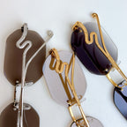 Bvlgari sunglasses with metal frames and mirrored lenses in silver, gold, and dark purple