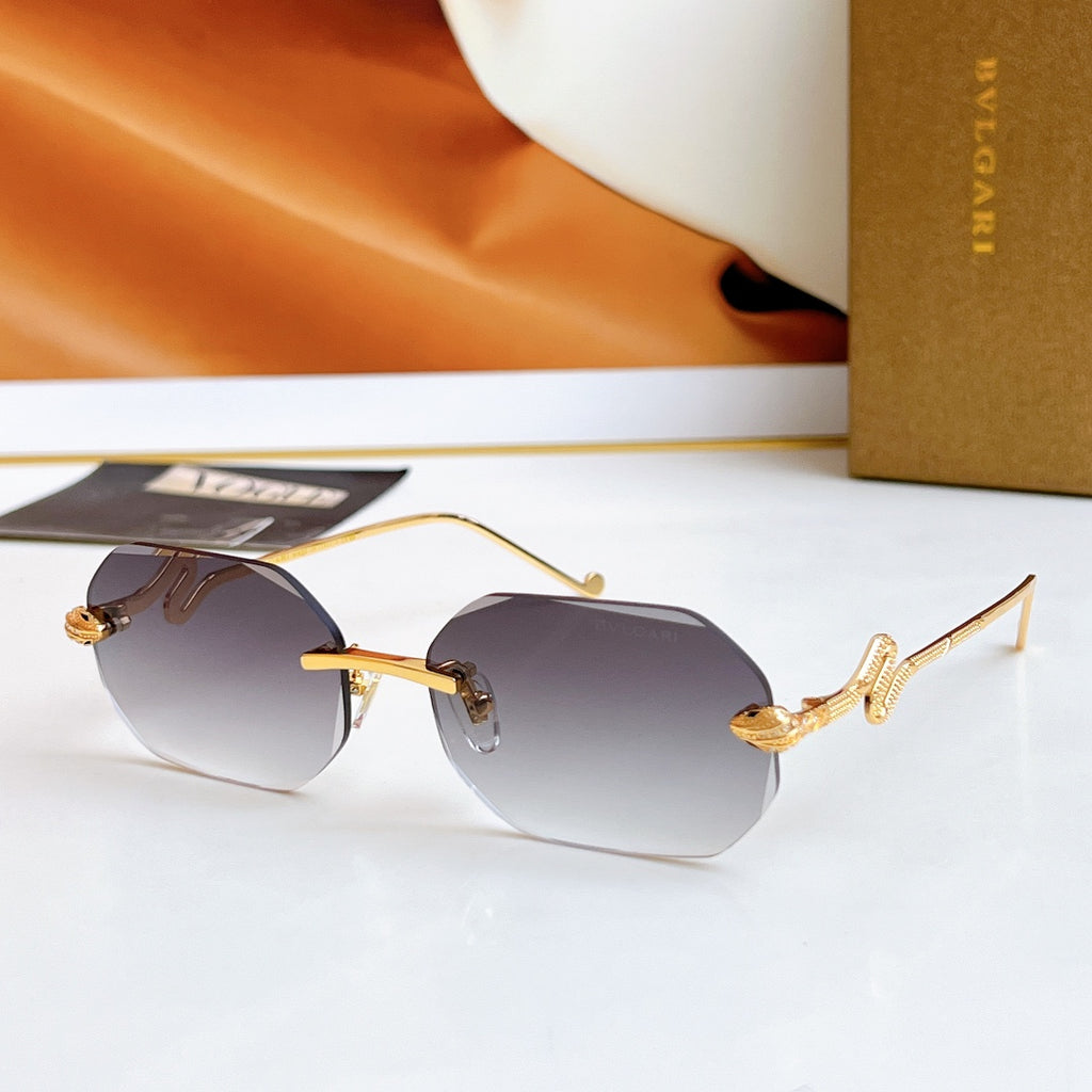 Bvlgari sunglasses with gold frame and dark gray mirrored lenses