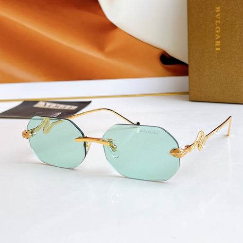 Bvlgari sunglasses with gold frame and turquoise mirrored lenses