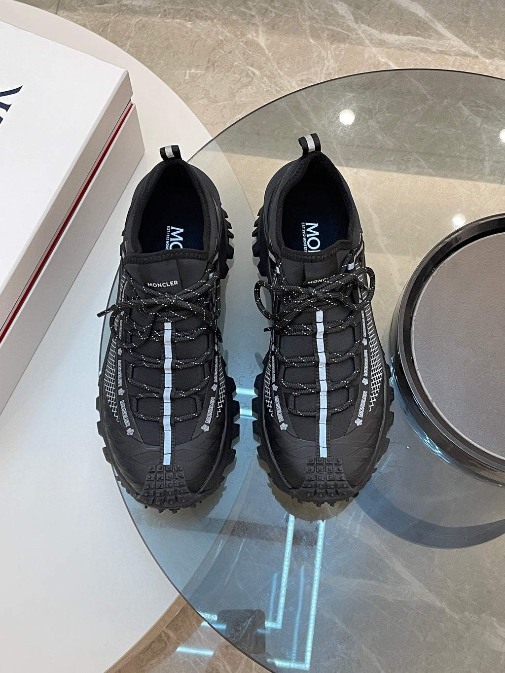 Black Moncler lace-up sneakers, pair view with textured mesh side panels
