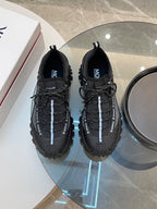 Black Moncler lace-up sneakers, pair view with textured mesh side panels