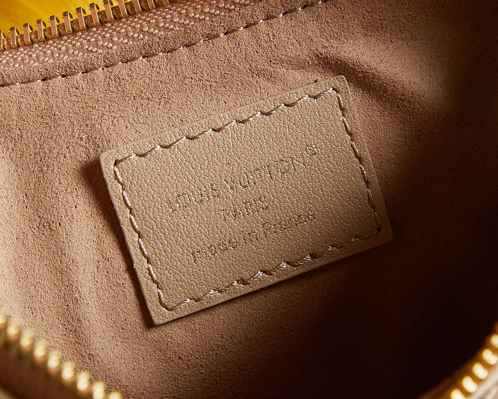 Louis Vuitton beige leather interior label card with stitched border
