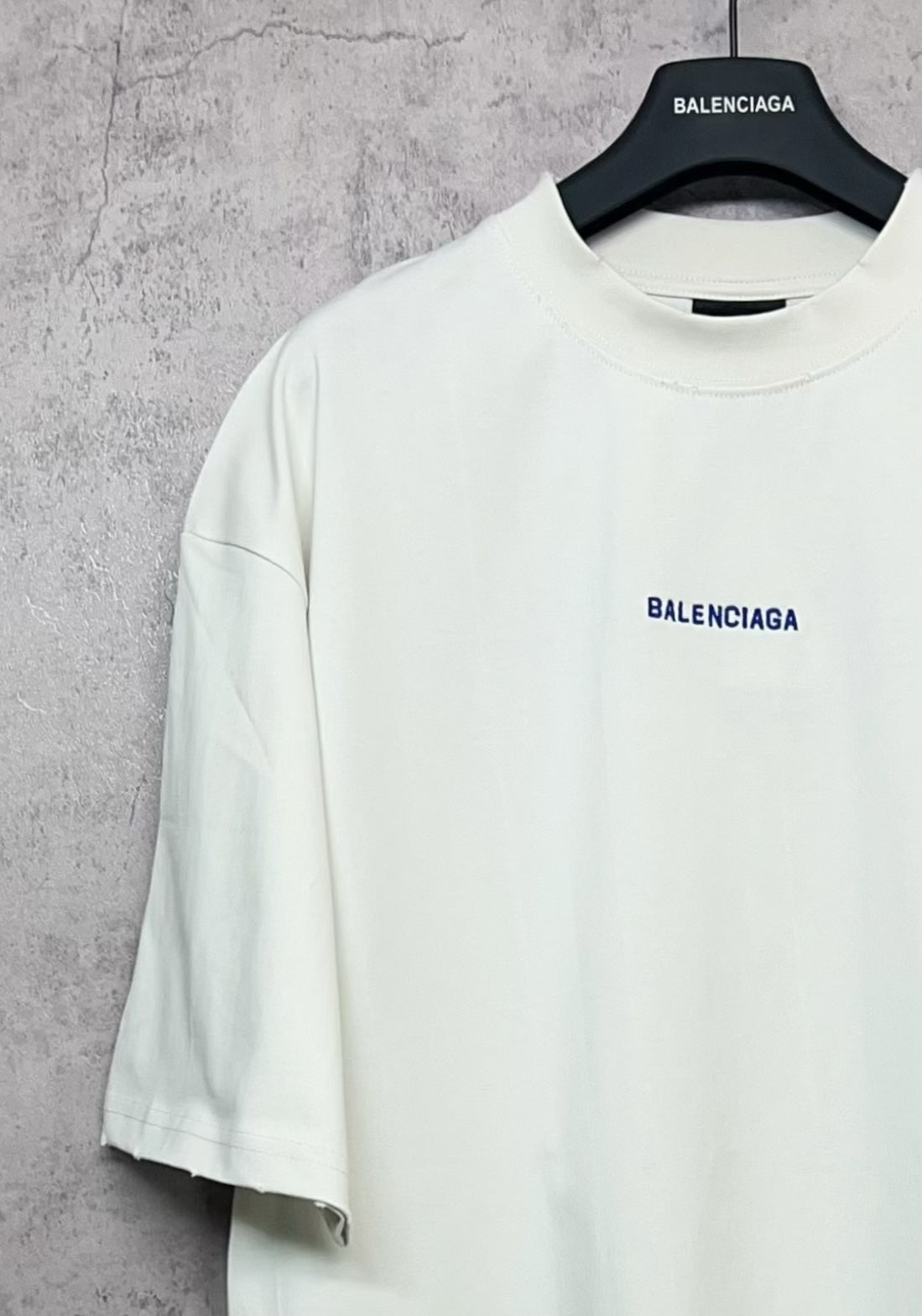 White short-sleeve T-shirt with Balenciaga logo on the chest