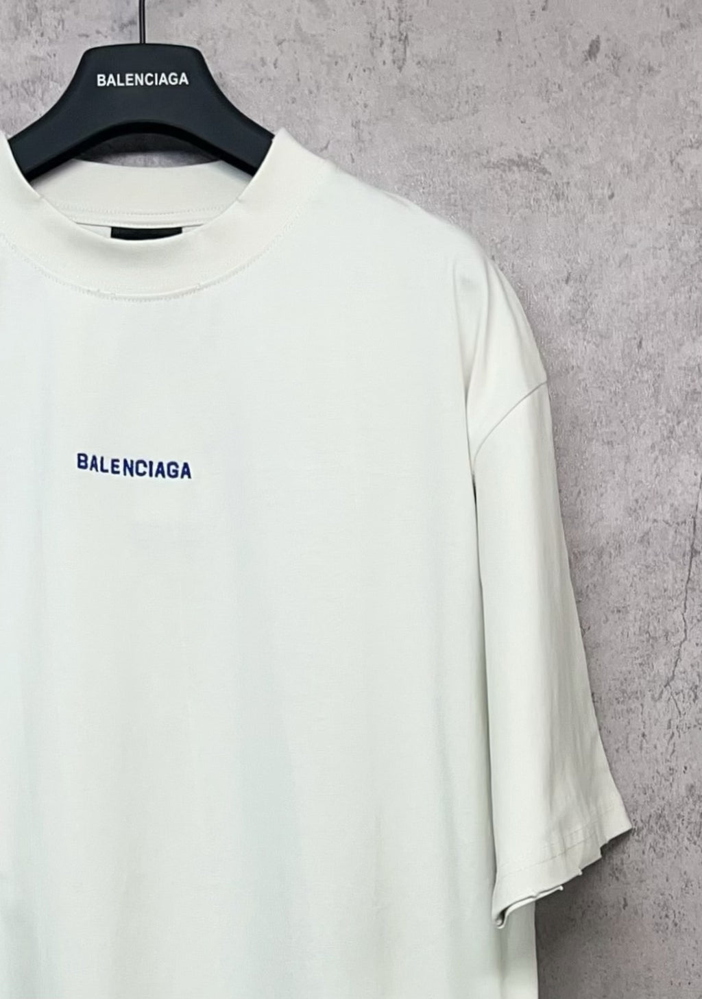 White short-sleeve T-shirt with crew neckline and small black Balenciaga logo