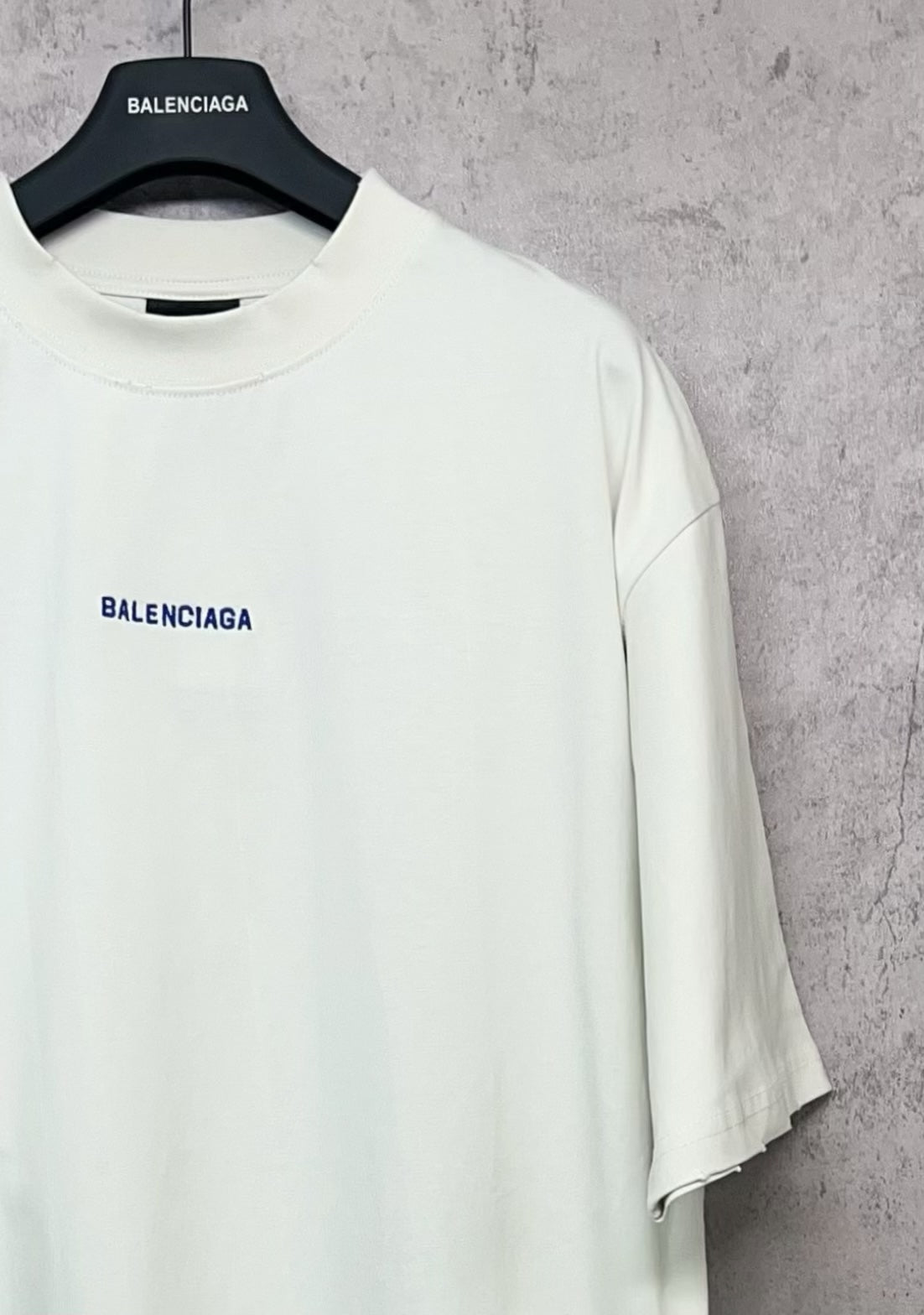 White short-sleeve T-shirt with crew neckline and small black Balenciaga logo