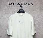 White short-sleeve T-shirt with small black Balenciaga logo at the chest