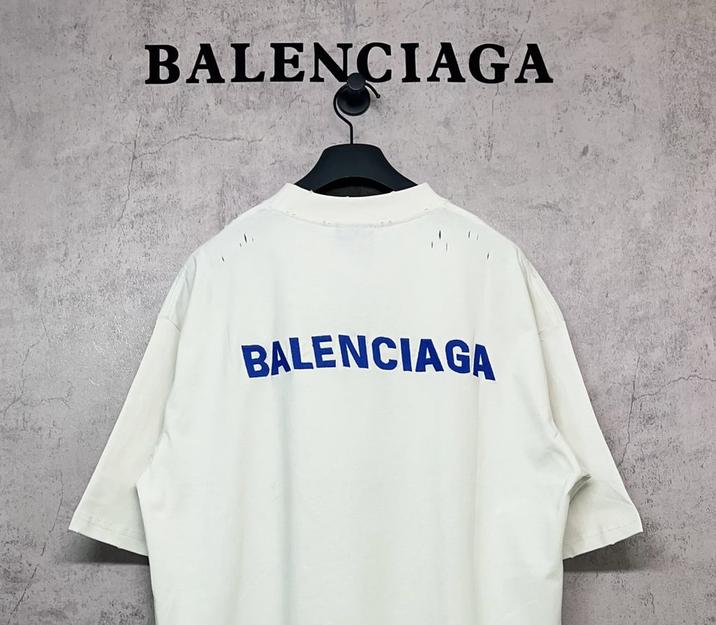 White short-sleeve T-shirt with blue Balenciaga logo on the back