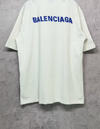 White short-sleeve T-shirt with large blue Balenciaga logo on the back