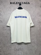 White short-sleeve T-shirt with blue Balenciaga logo on the back