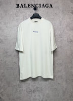 White short-sleeve T-shirt with small black Balenciaga logo on the chest
