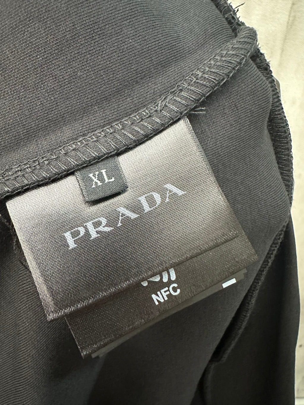 XL Prada inner label with NFC tag on neckline