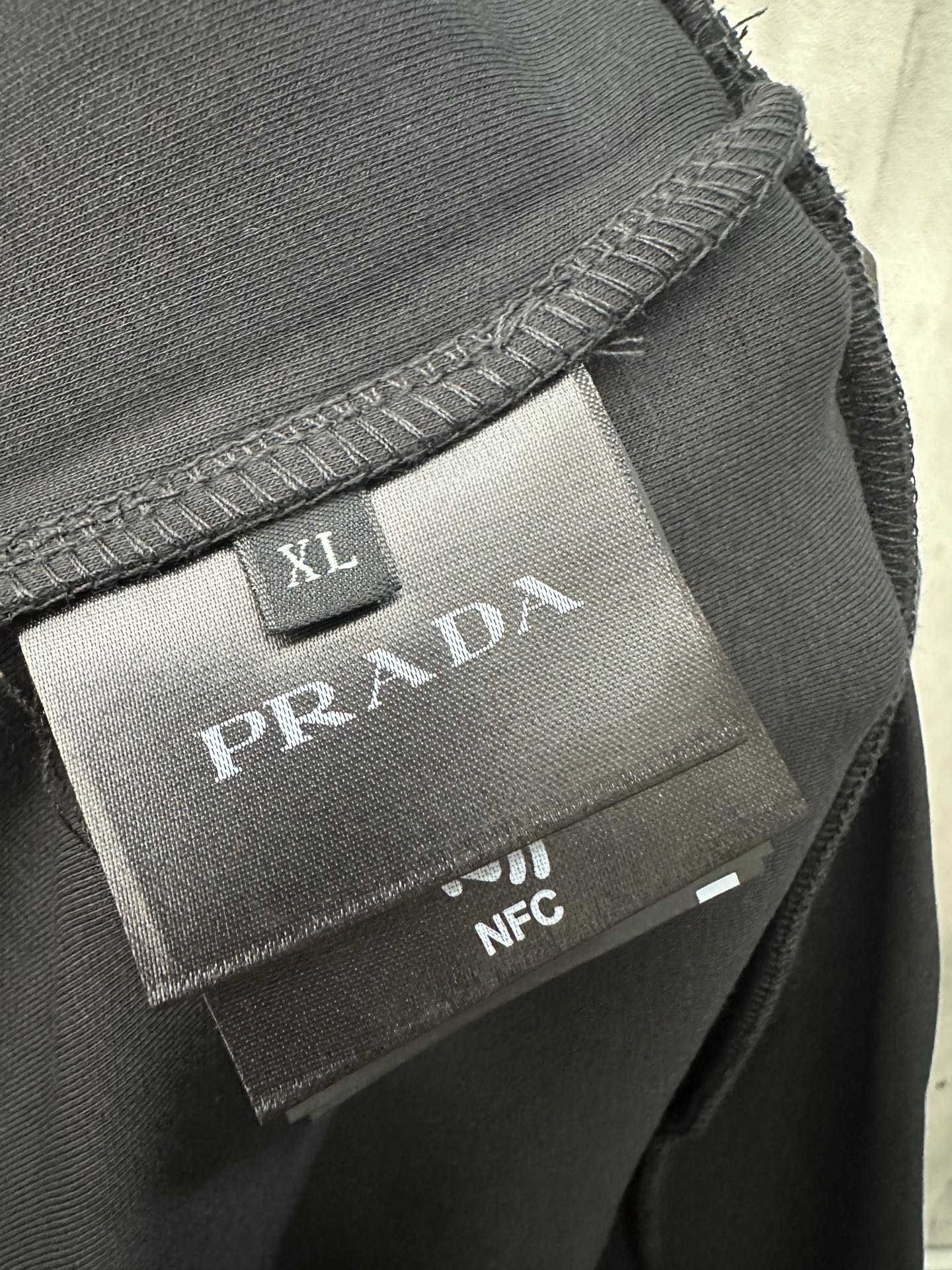XL Prada inner label with NFC tag on neckline