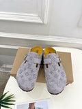 Monogram slide sandals in light gray with adjustable strap and metal buckle