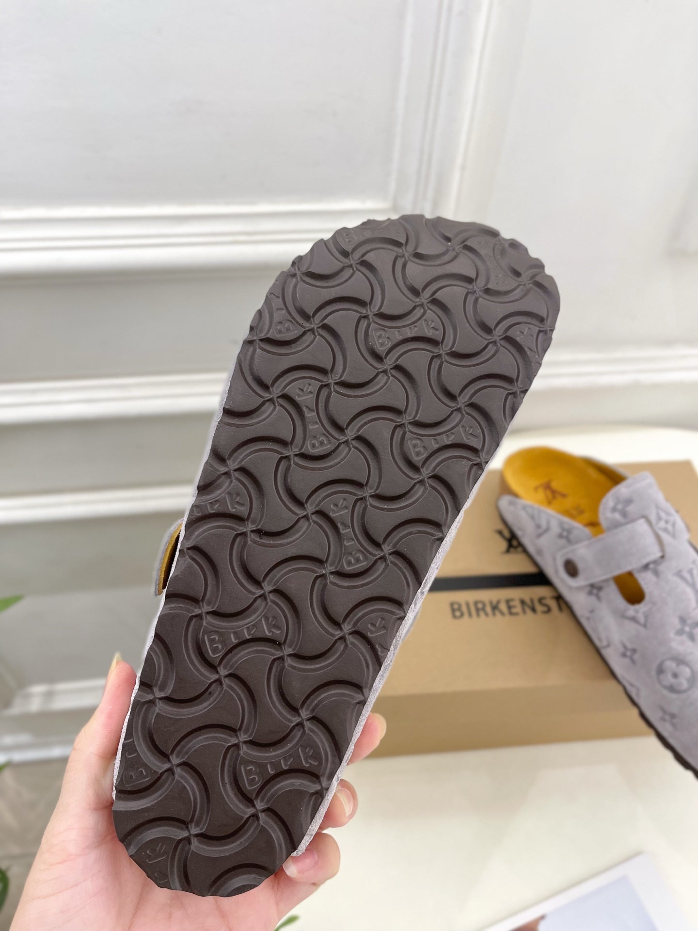 Monogram slide sandal outsole in dark gray with textured tread pattern