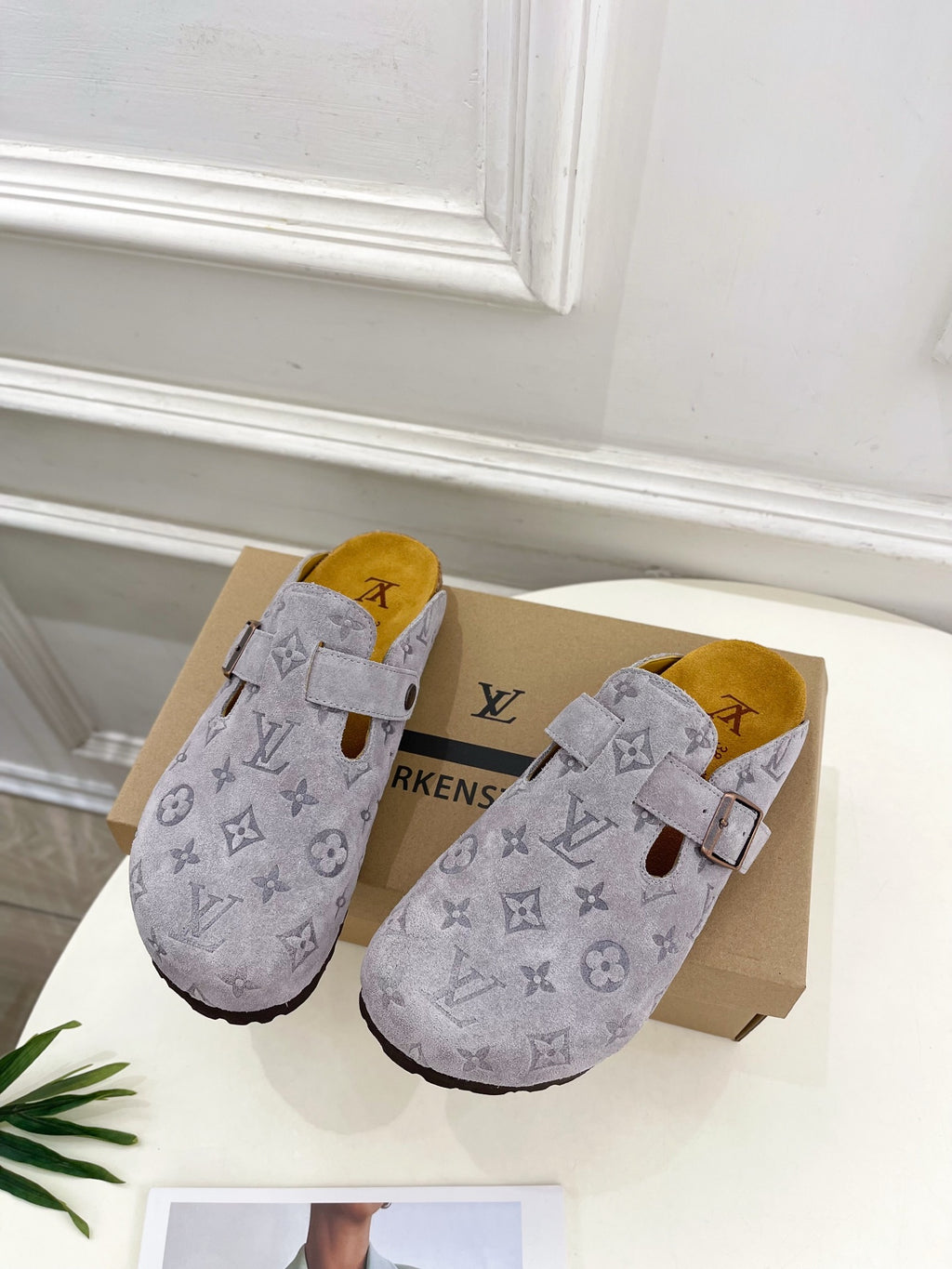 Monogram slide sandals in light gray with adjustable strap and suede-style finish