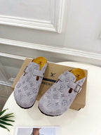 Monogram slide sandals in light gray with adjustable strap and suede-style finish