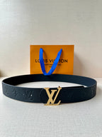 Louis Vuitton belt in dark blue leather with embossed pattern and gold-tone LV buckle