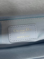 Dior logo leather label reading Christian Dior Paris, Made in... on handbag lining