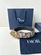 Dior belt with beige logo canvas strap and gold-toned emblem buckle