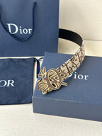 Dior belt with beige logo canvas strap and gold-toned emblem buckle