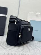 Prada bag, black crossbody with side zip pocket and logo-trim front flap