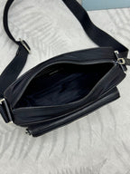 Prada bag, black crossbody with open zip pocket and dual zipper compartments